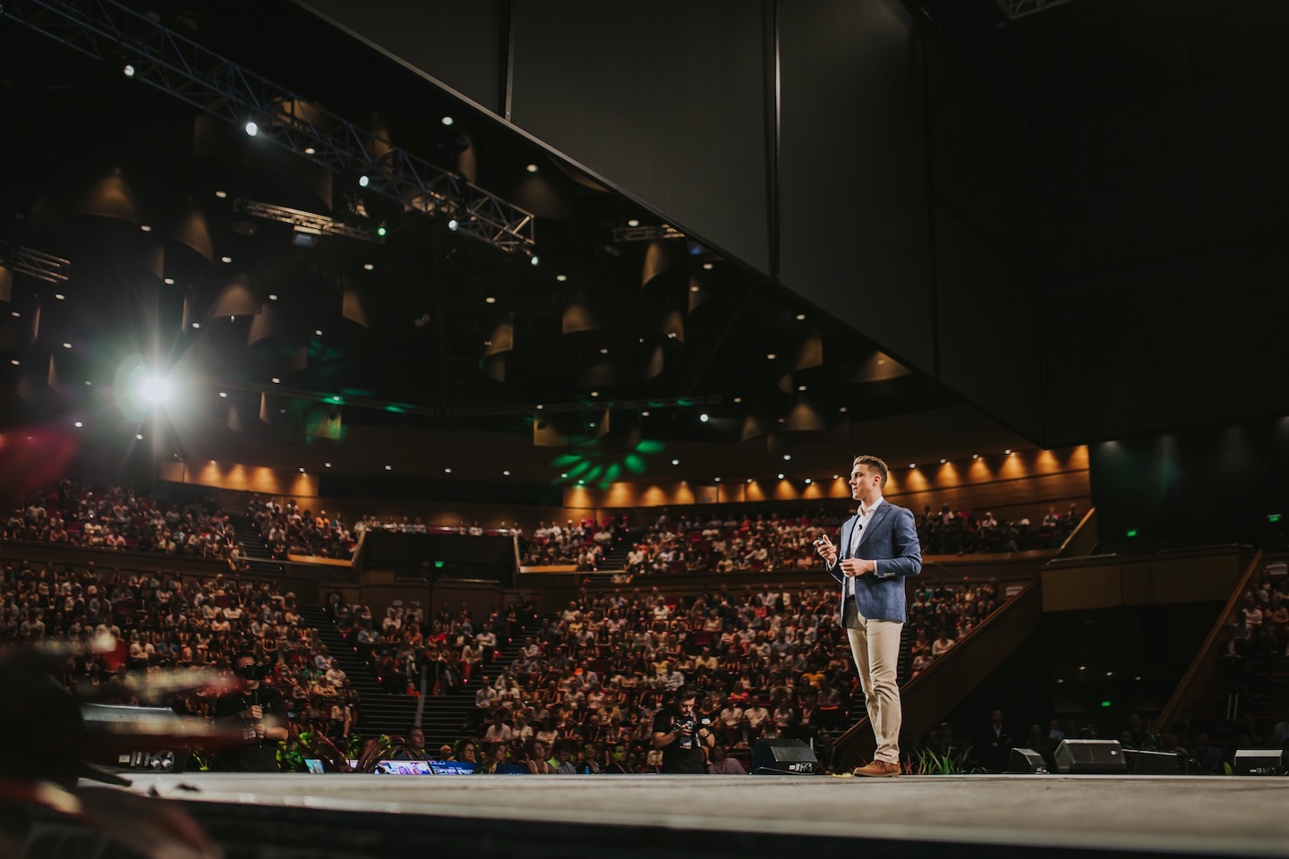 Steve Olejnik speaking to a large audience